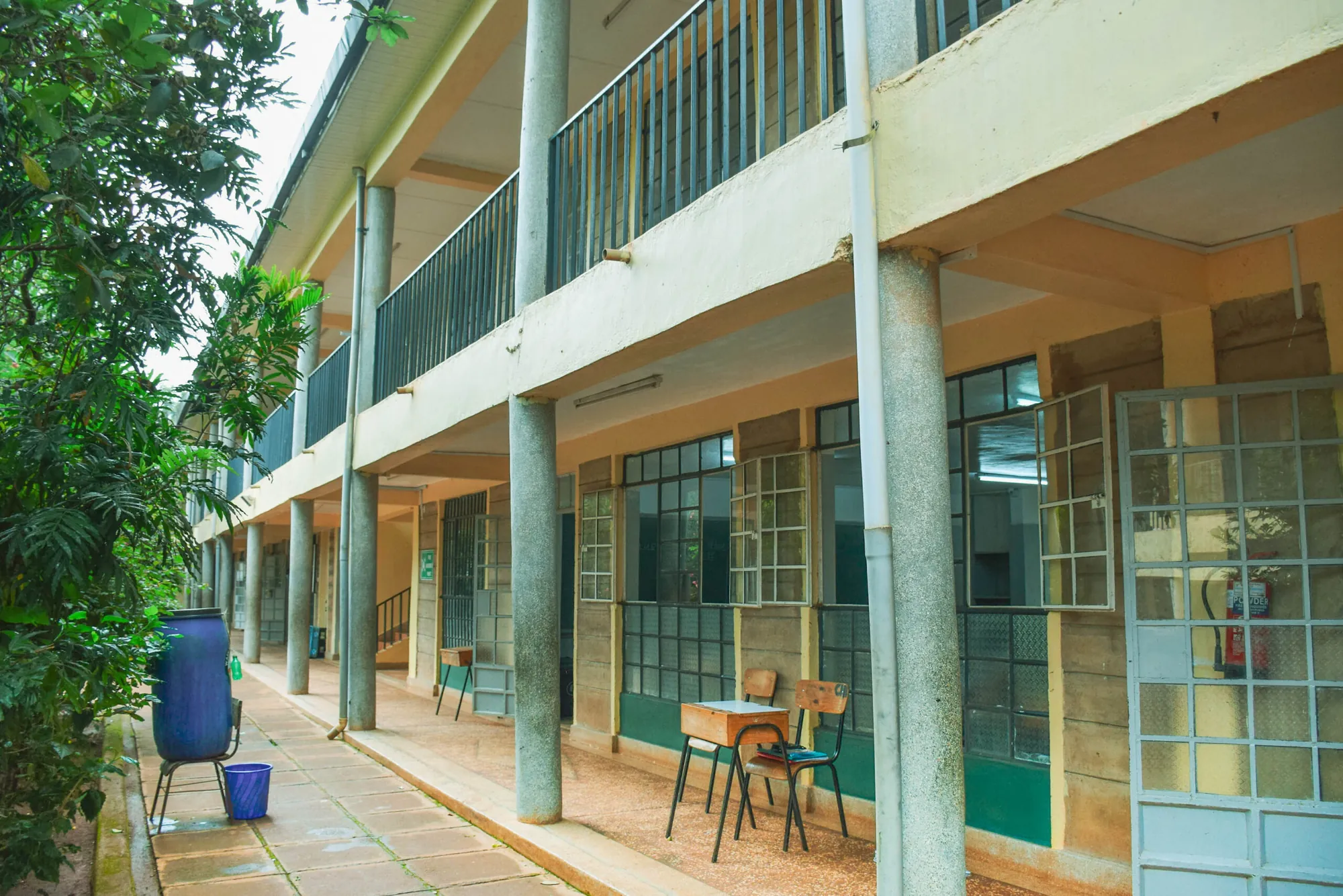 A long open-sided corridor beside the classroom block
