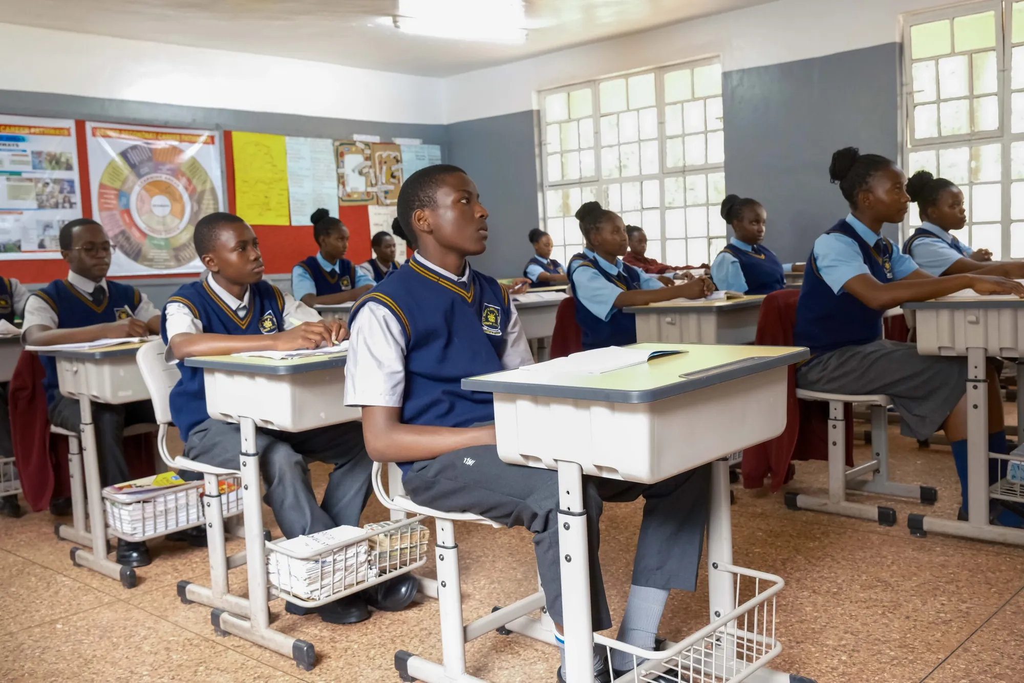 Senior students seated at desks in a classroom