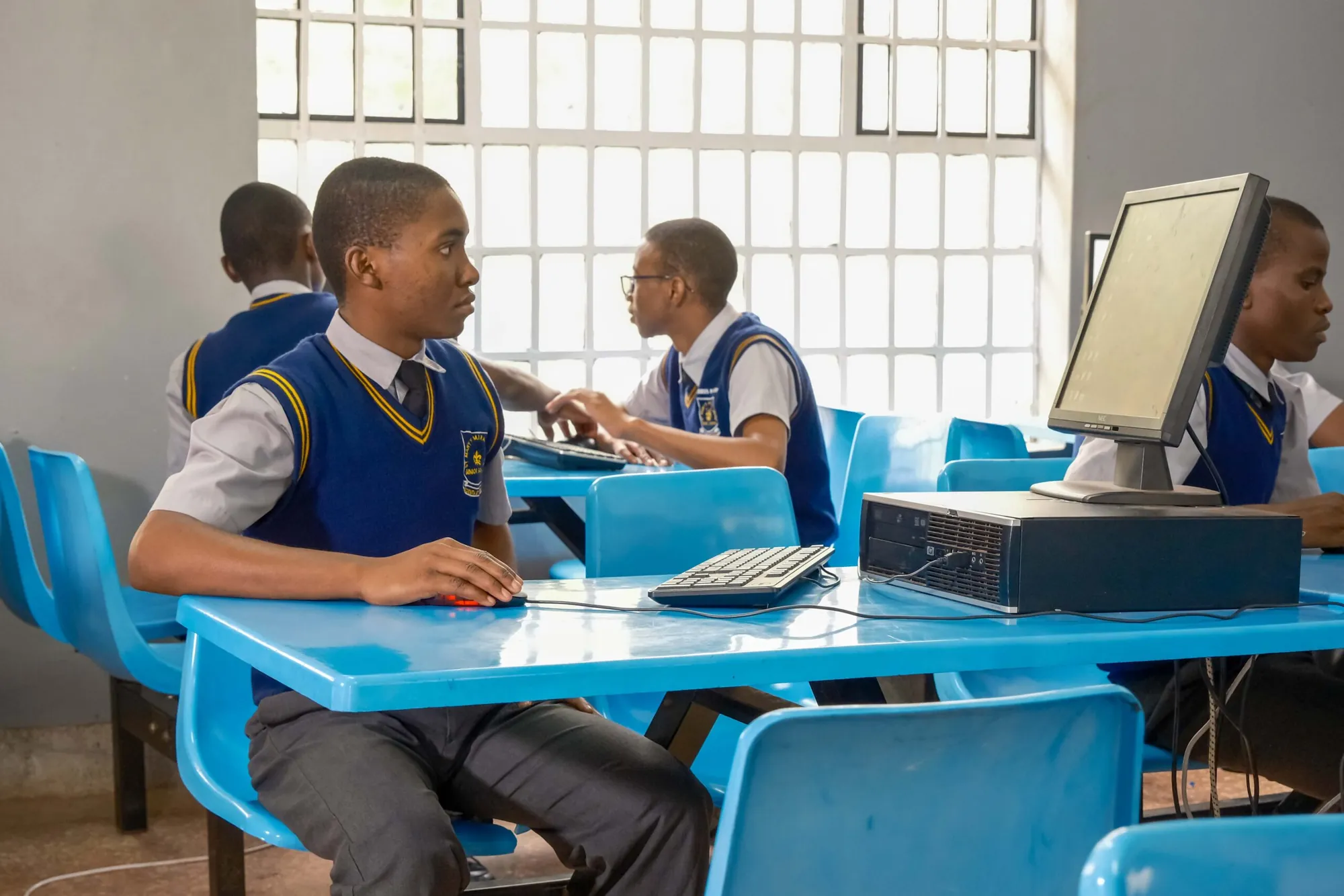 Two students working together at a computer